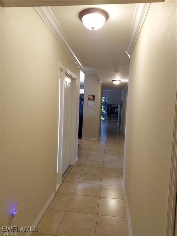 517 Robin Hood Cir Unit 102, Naples, FL 34104 - corridor featuring crown molding, light tile patterned floors, and baseboards