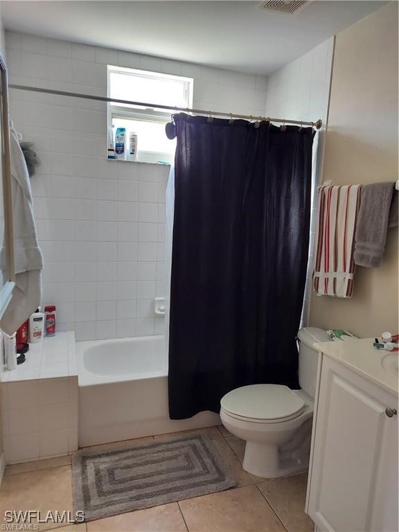 full bathroom with shower / bathtub combination with curtain, tile patterned flooring, vanity, and toilet