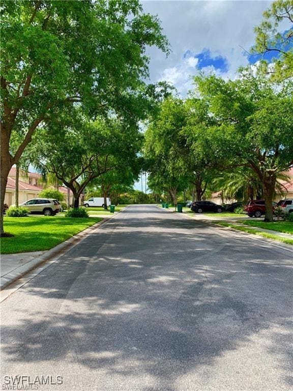 517 Robin Hood Cir Unit 102, Naples, FL 34104 - view of asphalt street featuring curbs