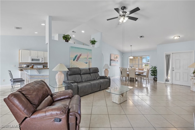 tiled living room with vaulted ceiling and ceiling fan