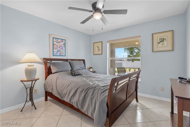 tiled bedroom featuring ceiling fan