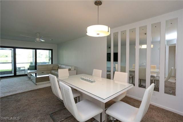 5754 Deauville Cir Unit E104, Naples, FL 34112 - dining area featuring dark carpet, ceiling fan, and baseboards