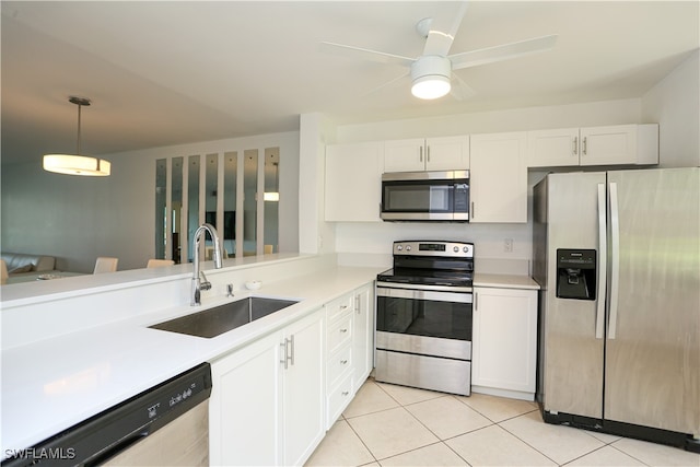 kitchen featuring sink, white cabinetry, stainless steel appliances, decorative light fixtures, and ceiling fan