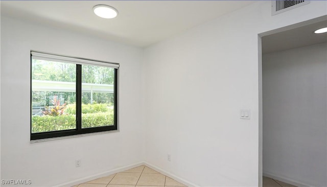 5754 Deauville Cir Unit E104, Naples, FL 34112 - unfurnished room featuring light tile patterned flooring and baseboards