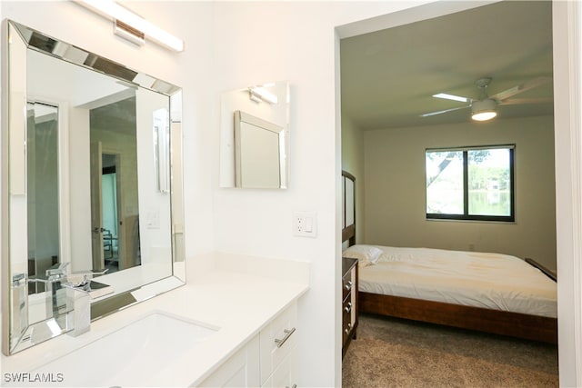 carpeted bedroom featuring sink and ceiling fan