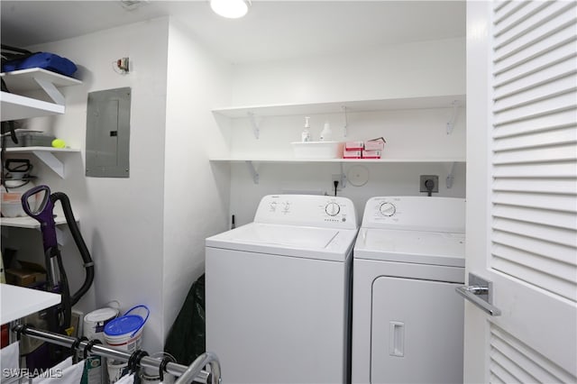 washroom with washer and clothes dryer and electric panel