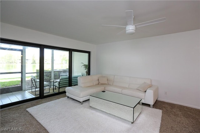 5754 Deauville Cir Unit E104, Naples, FL 34112 - carpeted living room featuring a ceiling fan and baseboards