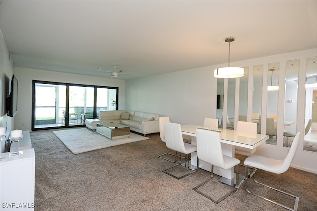 dining area featuring ceiling fan and carpet floors