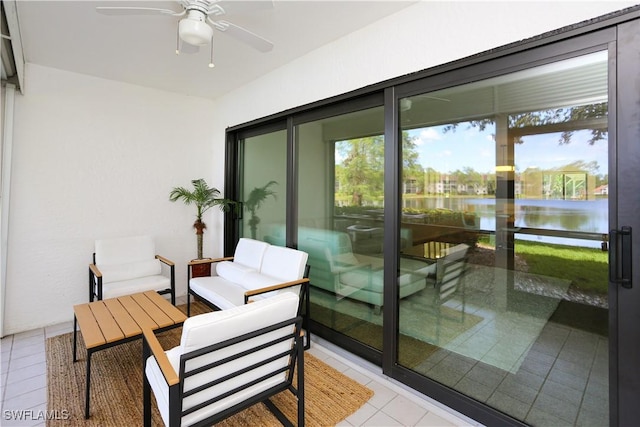 5754 Deauville Cir Unit E104, Naples, FL 34112 - balcony featuring a ceiling fan, a water view, and outdoor lounge area