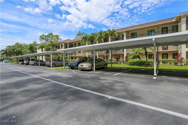 view of vehicle parking featuring a carport