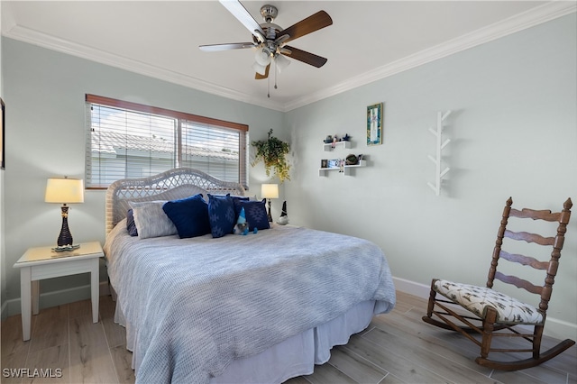 bedroom featuring ornamental molding, ceiling fan, and light hardwood / wood-style flooring