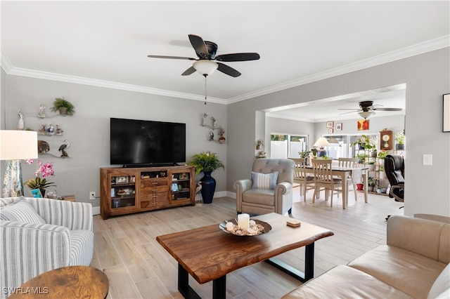 living room featuring ornamental molding, ceiling fan, and light hardwood / wood-style flooring