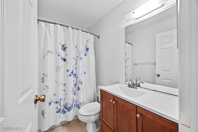 bathroom with a shower with shower curtain, tile patterned flooring, vanity, and toilet