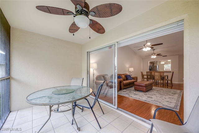 sunroom / solarium with lofted ceiling and ceiling fan