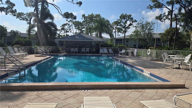 view of swimming pool with a patio