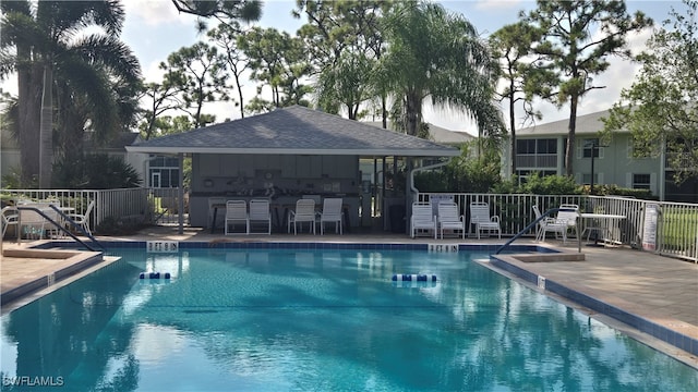 view of swimming pool with a patio area