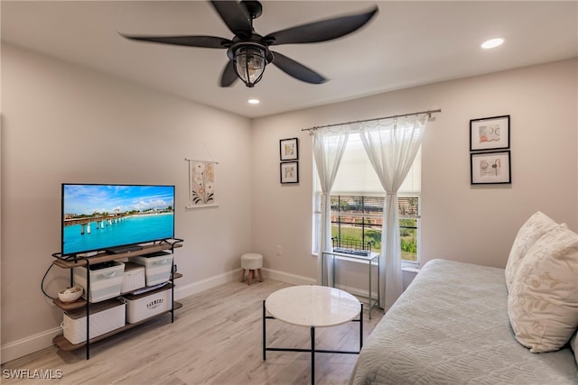 bedroom with light wood-type flooring and ceiling fan