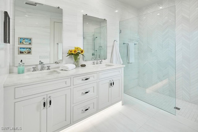 803 Shadow Lake Ln, Naples, FL 34108 - full bath featuring a shower stall, double vanity, and tile walls