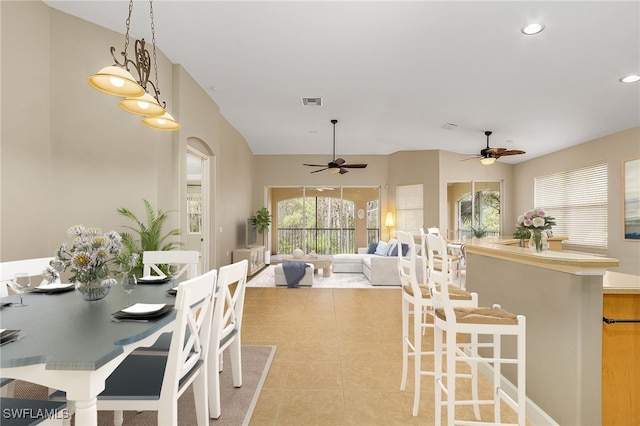 dining area featuring ceiling fan and light tile patterned flooring