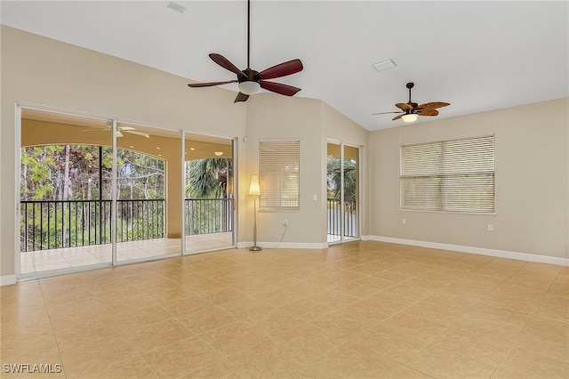 unfurnished room with ceiling fan, lofted ceiling, and light tile patterned floors