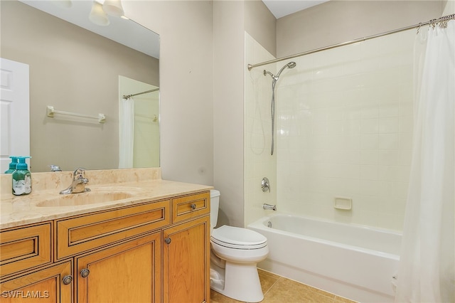 full bathroom featuring vanity, tile patterned flooring, toilet, and shower / bath combo