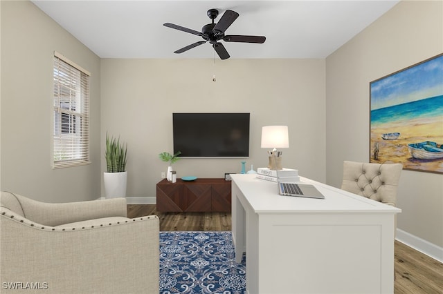 living room featuring ceiling fan and light wood-type flooring