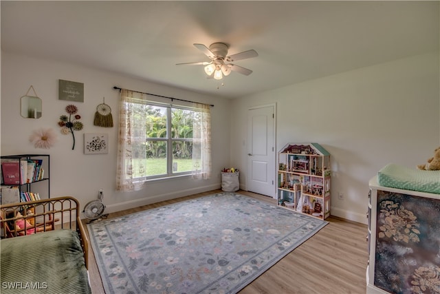 interior space with light hardwood / wood-style flooring and ceiling fan