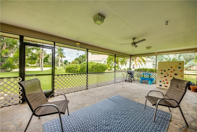 sunroom / solarium with ceiling fan