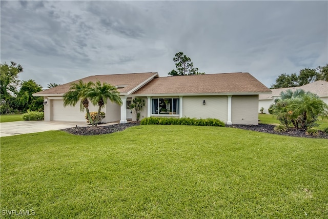 single story home featuring a front yard and a garage