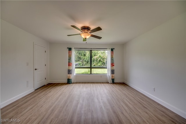 empty room with light hardwood / wood-style floors and ceiling fan