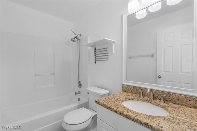 full bathroom with toilet, vanity, and washtub / shower combination