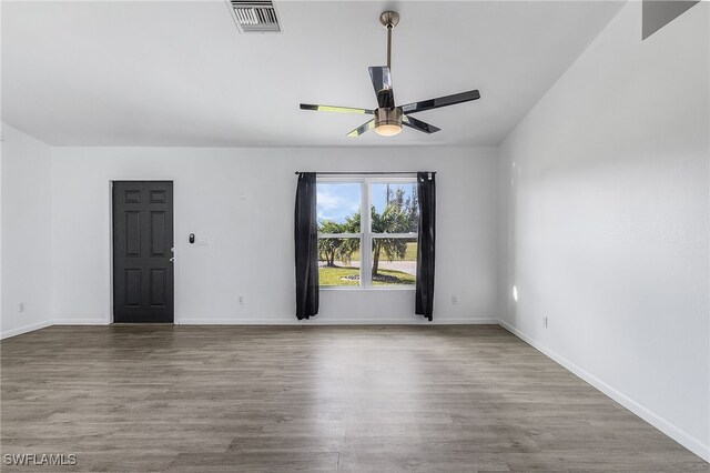 1905 SW 11th St, Cape Coral, FL 33991 - unfurnished room with ceiling fan, wood finished floors, and baseboards