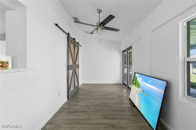 1905 SW 11th St, Cape Coral, FL 33991 - hall featuring a barn door, plenty of natural light, and wood finished floors