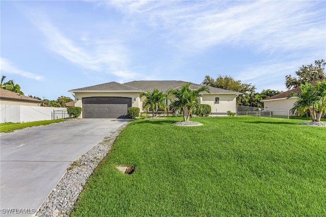 view of front of home featuring a front yard and a garage