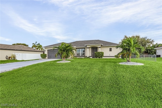 single story home with a garage and a front lawn