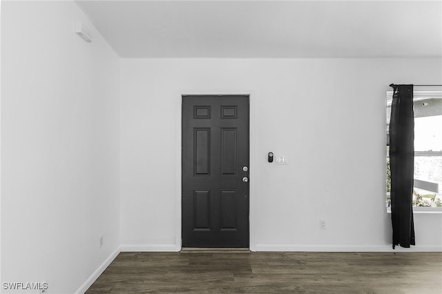 empty room with dark hardwood / wood-style floors