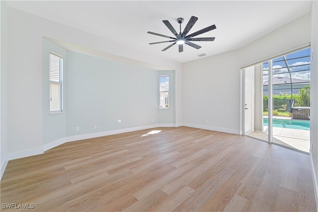 unfurnished room with ceiling fan and light hardwood / wood-style flooring