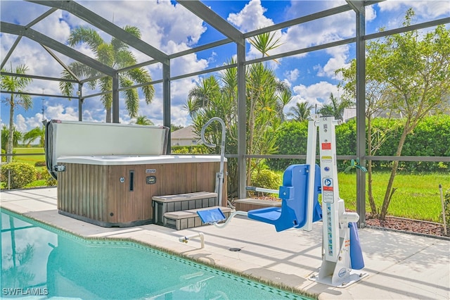 view of pool featuring a hot tub, glass enclosure, and a patio