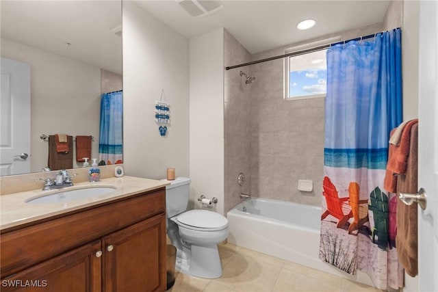 full bathroom featuring tile patterned floors, vanity, toilet, and shower / bath combo