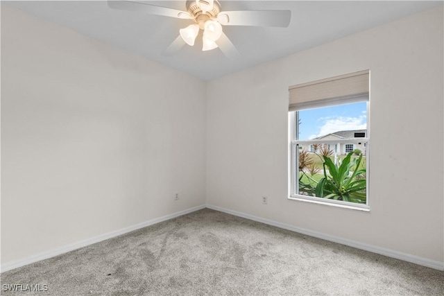 unfurnished room featuring ceiling fan and light colored carpet