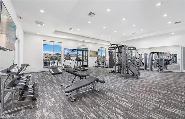 workout area with dark carpet