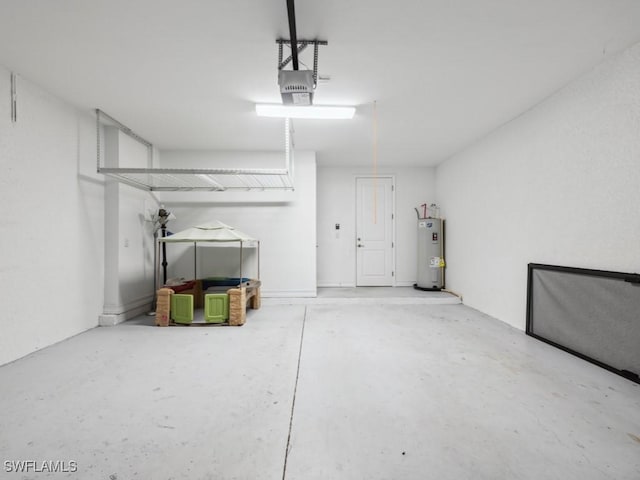 garage with water heater and a garage door opener