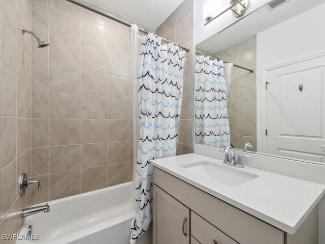 bathroom featuring vanity and shower / bath combo