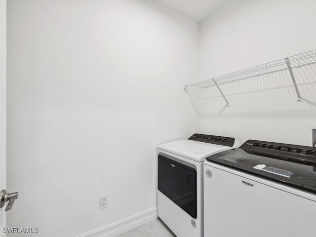 laundry room with washing machine and dryer