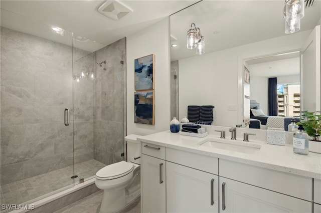 ensuite bathroom with visible vents, toilet, ensuite bathroom, a stall shower, and vanity