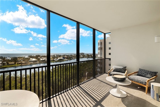 balcony featuring a water view