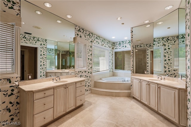 bathroom with plus walk in shower, tile patterned floors, and vanity