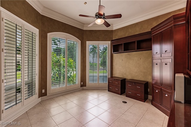 interior space with ceiling fan, crown molding, light tile patterned floors, and access to outside