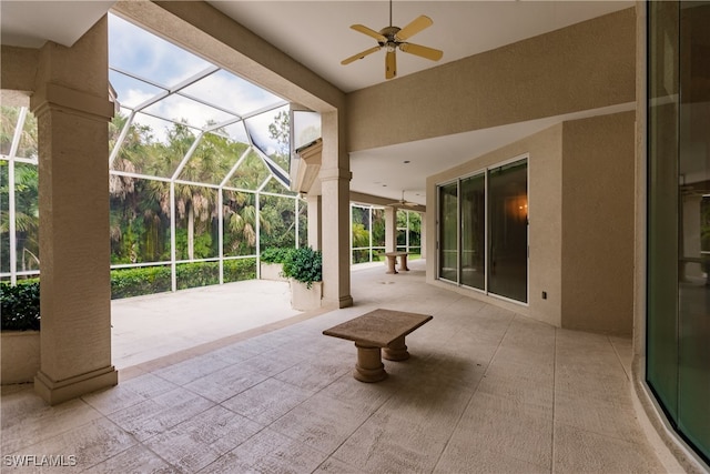 view of patio / terrace with glass enclosure and ceiling fan