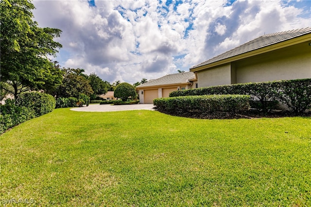 view of yard with a garage